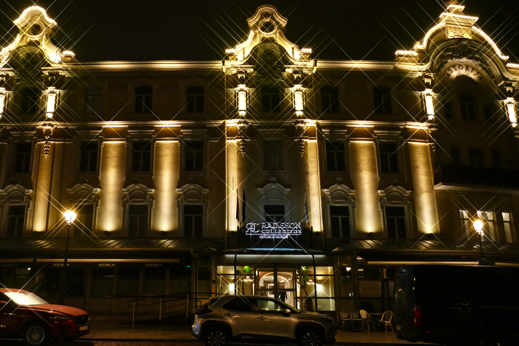 Night view of the Radisson Collection Astorija Hotel in Vilnius.