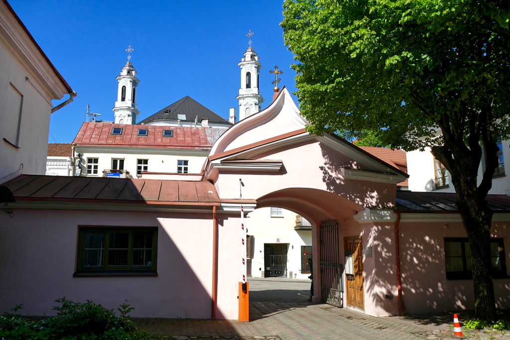 View of the Holy Trinity Uniate Church through the gate of the Orthodox Church of the Holy Spirit