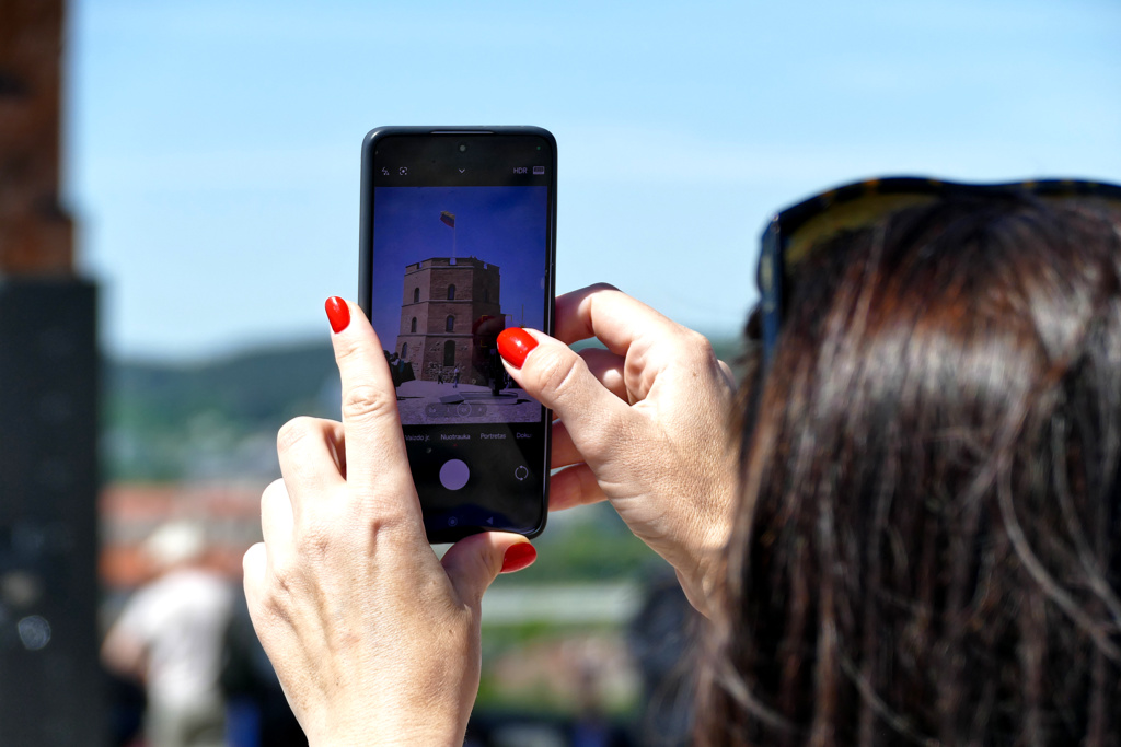 Woman taking a picture with her phone.
