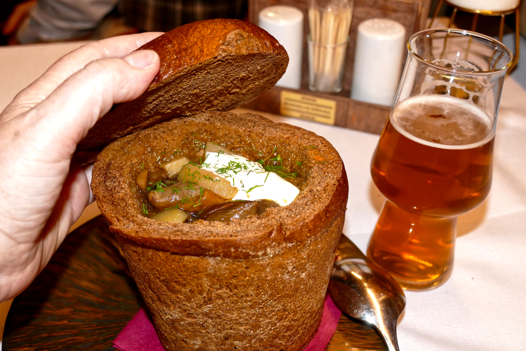 Mushroom soup served in a bowl made from rye bread.