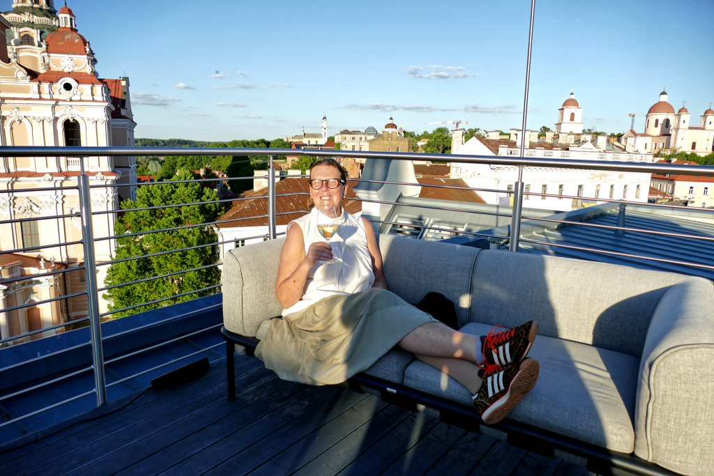 Renata Green in Vilnius on the roof top terrace of the Radisson Collection Astorija Hotel across from the iconic Church of St. Casimir.
