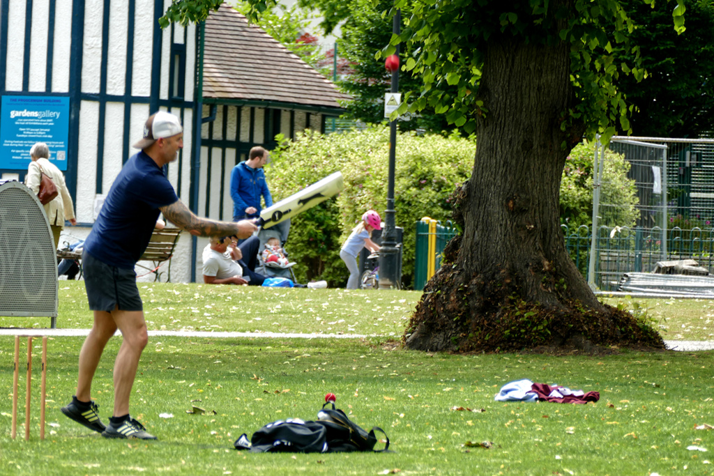 Man playing cricket at Montpellier Garden.