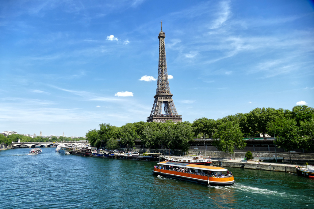 View of the Eiffel Tower and a Bateau Mouche in Paris.