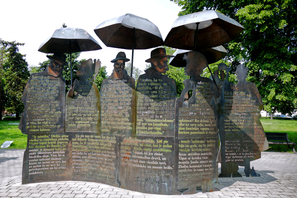 In his sculpture "The People of Riga," artist Girts Burvis has already prepared the people depicted for inclement weather. It stands just outside the city center in the Riga municipal garden.