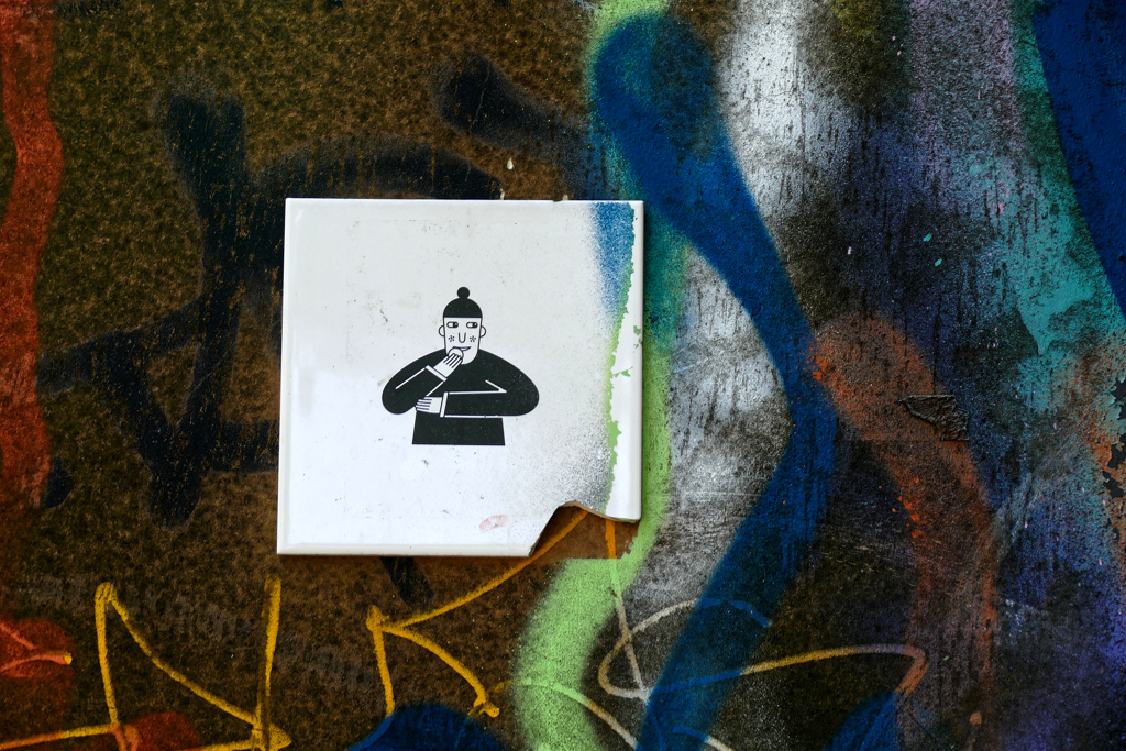 A ceramic tile designed by Zahars Ze spotted on a wall in Riga.