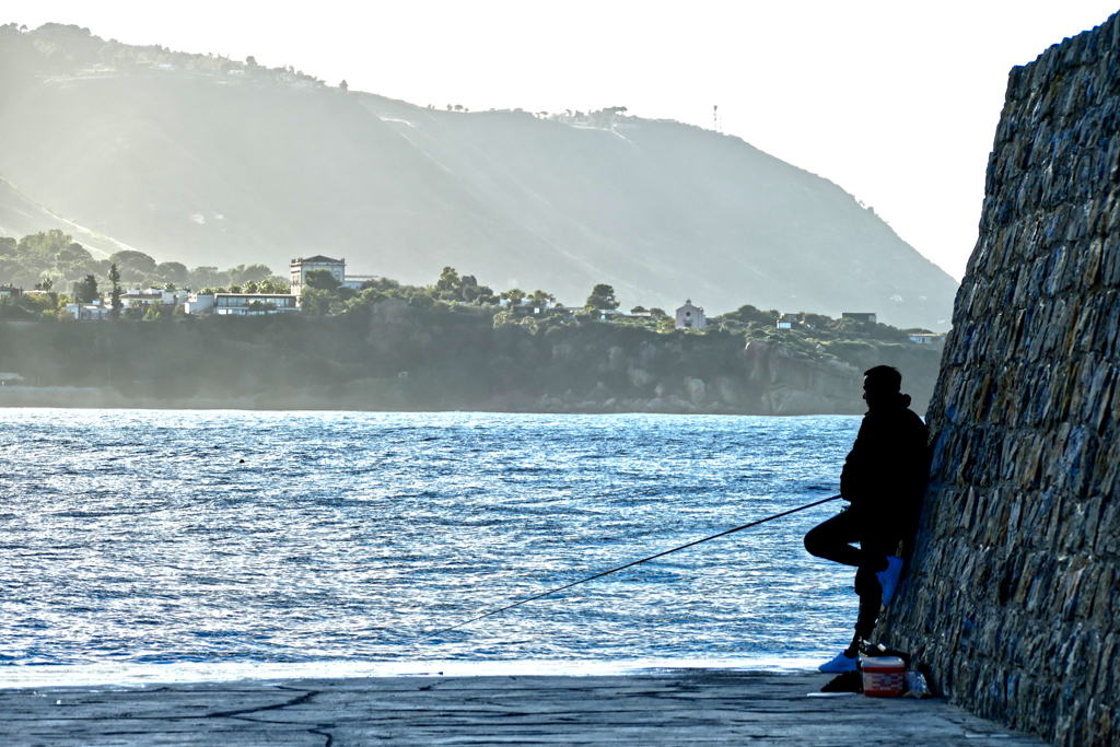 Man fishing in Cefalù.