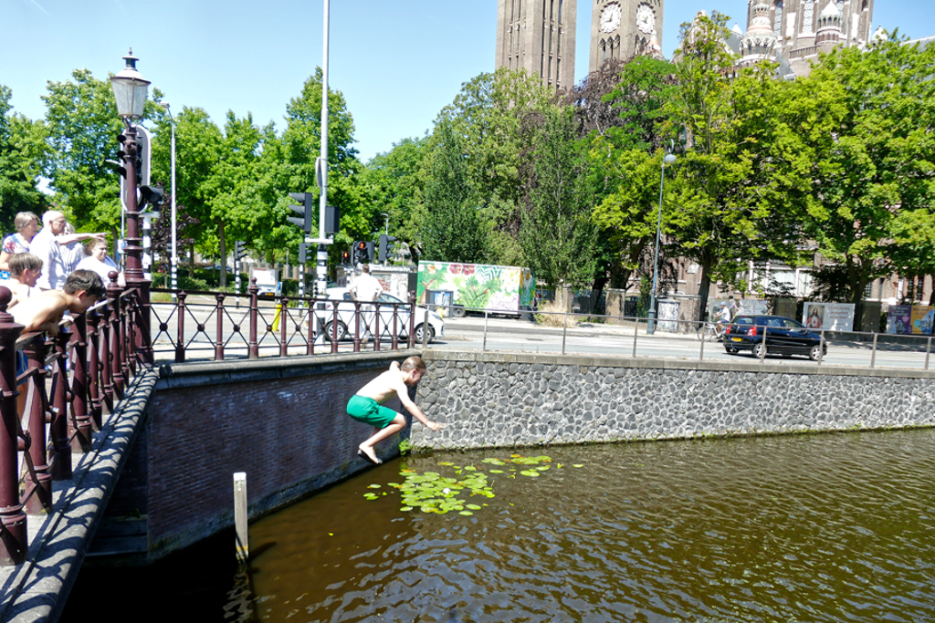 Boy jumping into the river.