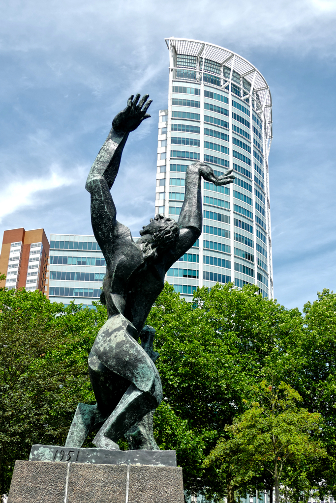 Osip Zedkin's De verwoeste stadt, hence, the destroyed city, a man throws his hands up in despair in front of the Millennium Tower.
