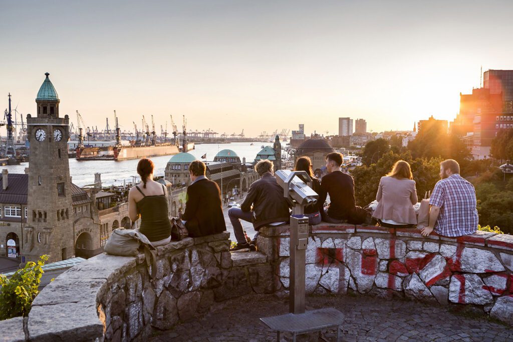 Young People overlooking the Harbor of Hamburg