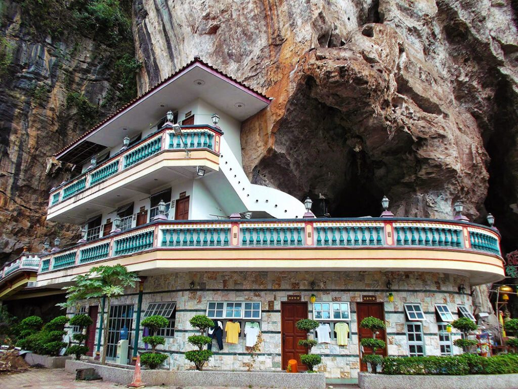 A house wrapped around a cave temple in Ipoh. an Underrated City in Malaysia