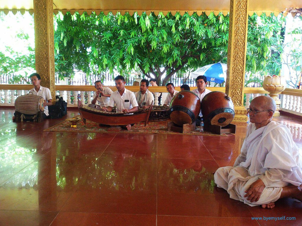 Traditional temple music at Preah Ang Chek - and a Buddhist nun.