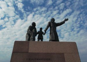 sculpture called Die Auswanderer, emigrants, is standing on the shore of the river Weser and remembers the seven million passing through the port of Bremerhaven.
