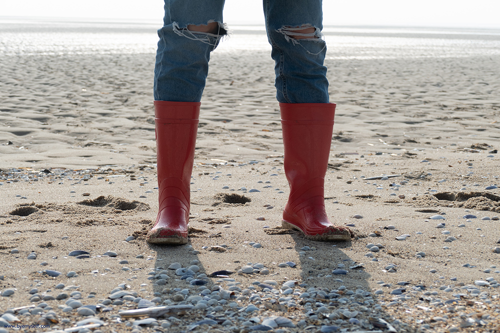 Woman in gumboot on the mudflat